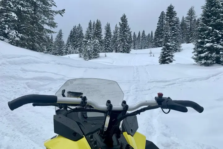a man that is standing in the snow